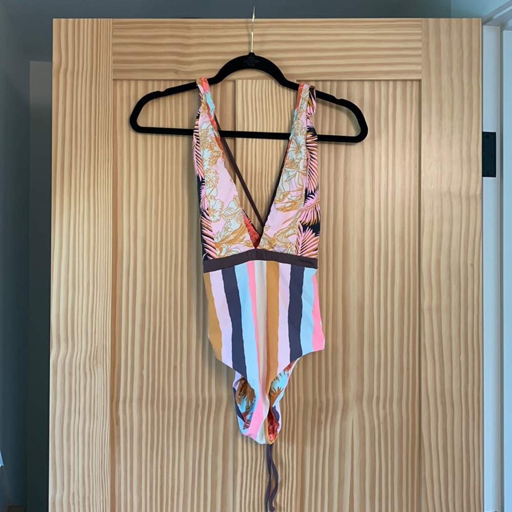 Reversible plunging neck one piece bathing suit